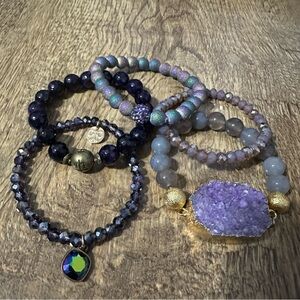 Five stretchy purple bracelets. Excellent condition.